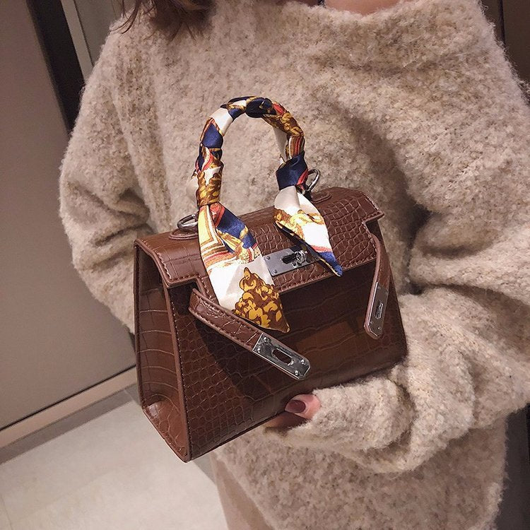 A Cross-Body Bag with a Stone Design