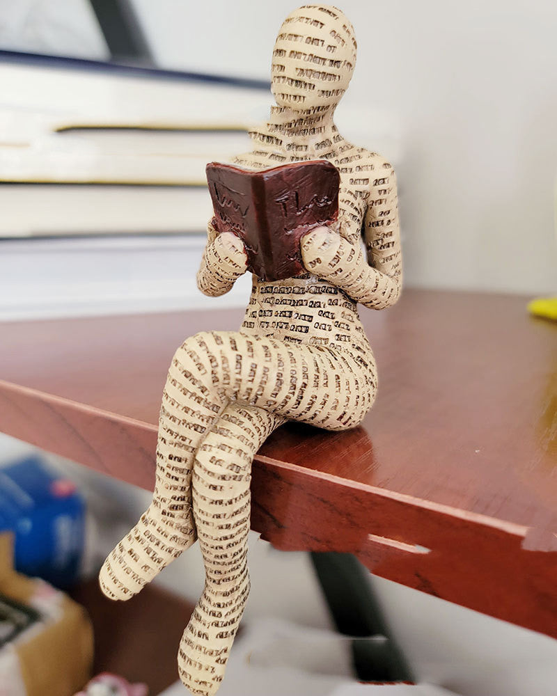 A Woman Reading A Paper Pulp Molding Ornament Tree