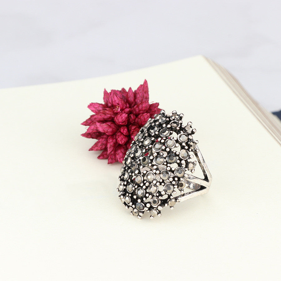 Dense Four-Prong Black Diamond Ring