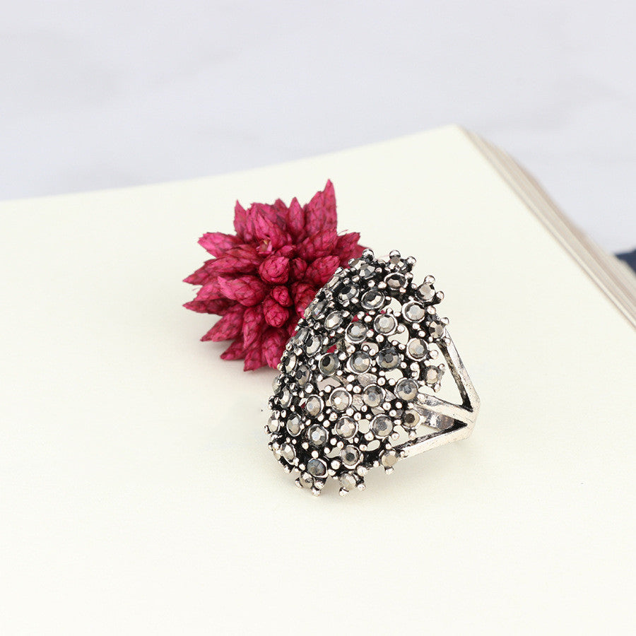 Dense Four-Prong Black Diamond Ring