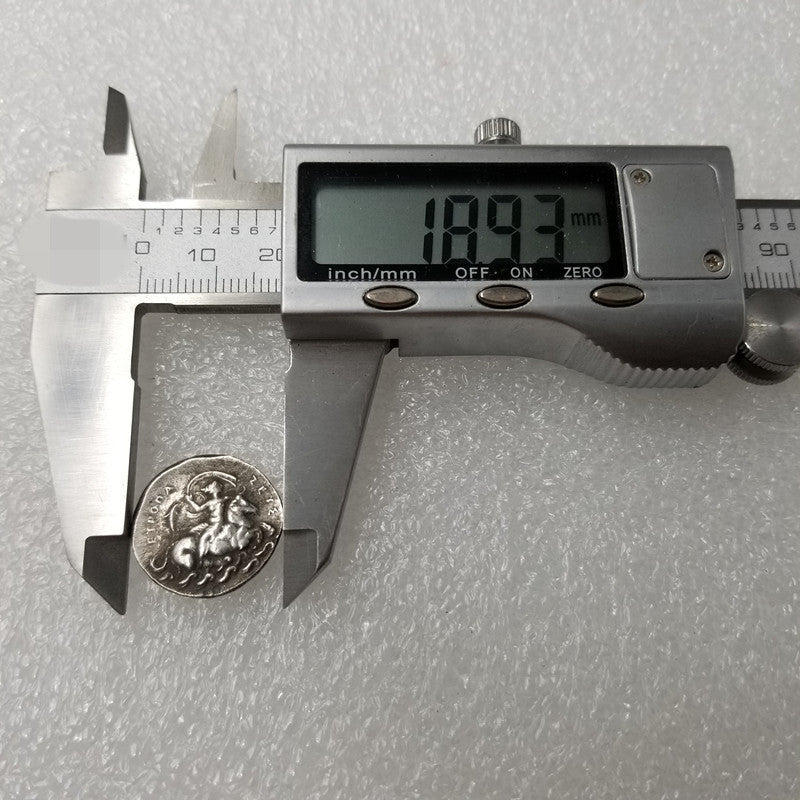 Embossed Greek Coin Can Blow Silver Dollar